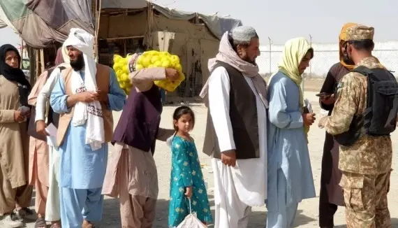 Afghan migrants detained in late-night police raids